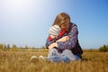 Happy young beautiful mather with baby on nature outdoor