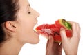 Happy young beautiful woman is eating watermelon. Royalty Free Stock Photo