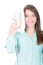 Happy young beautiful woman ironing clothes. Royalty Free Stock Photo