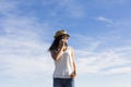 happy young beautiful woman talking on her mobile phone at sunset. Blue sky background. Outdoors. Lifestyle Royalty Free Stock Photo