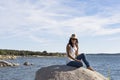 happy young beautiful woman talking on her mobile phone at sunset. Blue sky background. Outdoors. Lifestyle Royalty Free Stock Photo