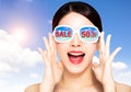 Happy young beauty in sunglasses with summer shopping and sale discount concepts