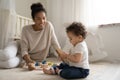 Young african American mother play with little baby Royalty Free Stock Photo