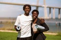 Happy Young Black Couple With Fitness Mats In Hands Posing Outdoors Royalty Free Stock Photo