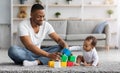 Happy Young Black Father Playing With His Infant Baby Son At Home Royalty Free Stock Photo