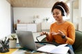 Black woman having videochat using laptop and talking at webcam Royalty Free Stock Photo