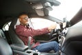 Happy young black guy driving car Royalty Free Stock Photo