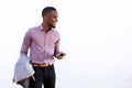 Happy young black guy with a mobile phone Royalty Free Stock Photo