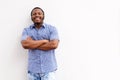 Happy young black guy smiling against white wall Royalty Free Stock Photo