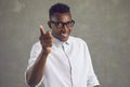 Happy handsome black man smiling and doing You& x27;re Right gesture isolated on gray background Royalty Free Stock Photo