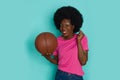 Happy Young Black Woman With Arfo Hair Is Posing With Basketball ball Royalty Free Stock Photo