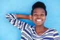 Happy young black woman smiling with hand behind head Royalty Free Stock Photo