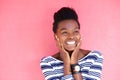 Happy young black woman smiling with hands on face Royalty Free Stock Photo