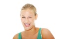 Happy young blond woman blinking. Royalty Free Stock Photo