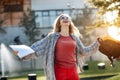 Happy young blonde woman student celebrate success after exams in university. Royalty Free Stock Photo