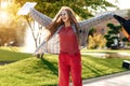 Happy young blonde woman student celebrate success after exams in university. Royalty Free Stock Photo