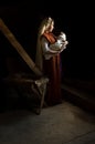 Mary in the stable near the manger with the baby