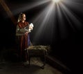 Mary in the stable near the manger with the baby