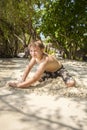 Happy young boy is digging in the sand Royalty Free Stock Photo