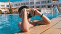 Happy Young Boy in Diving Mask Relaxing in Blue Water Pool at the Hotel of Egypt