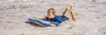 Happy Young boy having fun at the beach on vacation, with Boogie board BANNER, LONG FORMAT Royalty Free Stock Photo