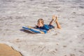 Happy Young boy having fun at the beach on vacation, with Boogie board Royalty Free Stock Photo