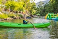 Happy young boy holding paddle in a kayak on the river, enjoying a lovely summer day Royalty Free Stock Photo