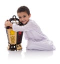 Happy Young Boy Hugging Ramadan Lantern