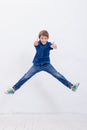 Happy young boy jumping on white background Royalty Free Stock Photo