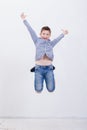 Happy young boy jumping on white background Royalty Free Stock Photo