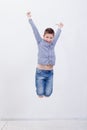 Happy young boy jumping on white background Royalty Free Stock Photo