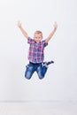 Happy young boy jumping on white background Royalty Free Stock Photo