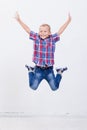 Happy young boy jumping on white background Royalty Free Stock Photo