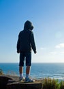 Happy, Young Boy Looking Over the Ocean Royalty Free Stock Photo