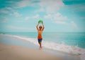 Happy young boy play ball on beach