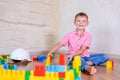 Happy young boy playing with his building blocks Royalty Free Stock Photo