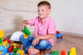 Happy young boy playing with his building blocks Royalty Free Stock Photo