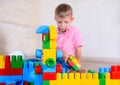 Happy young boy playing with his building blocks Royalty Free Stock Photo