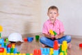 Happy young boy playing with his building blocks Royalty Free Stock Photo