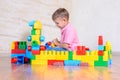 Happy young boy playing with his building blocks Royalty Free Stock Photo