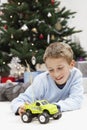 Happy Young Boy Playing With Toy Car At Home Royalty Free Stock Photo