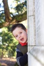 Happy young boy smiling in an outdoor scene Royalty Free Stock Photo