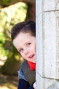 Happy young boy smiling in an outdoor scene Royalty Free Stock Photo