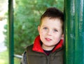 Happy young boy smiling in an outdoor scene Royalty Free Stock Photo