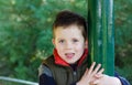 Happy young boy smiling in an outdoor scene Royalty Free Stock Photo