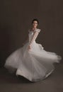 Happy young bride in dancing in a white wedding dress Royalty Free Stock Photo