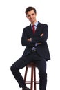 Happy young business man with hands crossed sitting Royalty Free Stock Photo