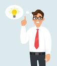 Happy young business man pointing up. Light bulb representing idea, solution in the thought bubble. Trendy person thinking. Royalty Free Stock Photo