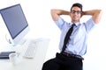 Happy young business man relaxing in modern office Royalty Free Stock Photo