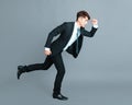 Happy young business man running in motion Royalty Free Stock Photo